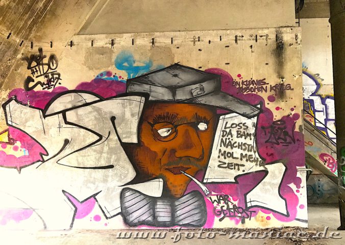 Männerporträt als Graffito an der Wand